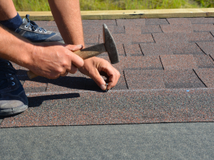Professional Livermore roofers swiftly repairing storm damage.