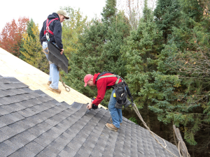 Expert roofers at work on a San Ramon home, showcasing high-quality craftsmanship.