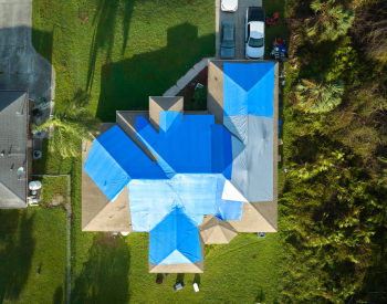 Temporary roof fix with tarps during an emergency